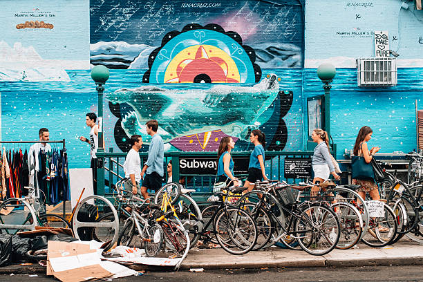 New York City, United States - August 30, 2015: People getting in and out of the subway in Williamsburg in Brooklyn.