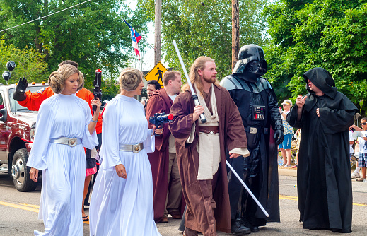 Twinsburg, OH, USA - August 8, 2015: Twins dressed as characters from Star Wars walk in the Double Take Parade, part of the 40th annual Twins Day festival, the largest gathering of twins in the world.