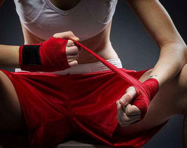 istock Boxing woman binds the bandage on his hand, before training 486359071