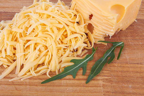 käse - cheese emmental cheese switzerland grated stock-fotos und bilder