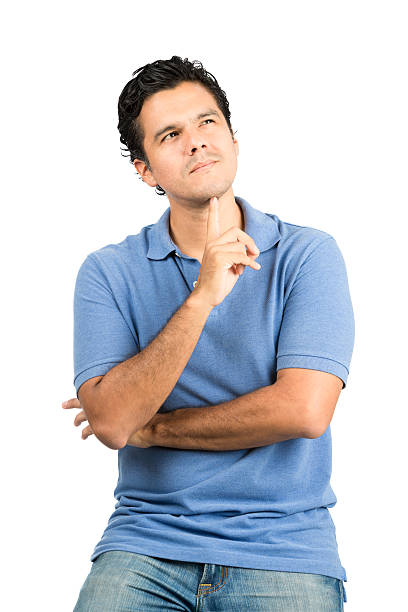 istock Wondering Hispanic Male Looking Up Arms Crossed V 486361260