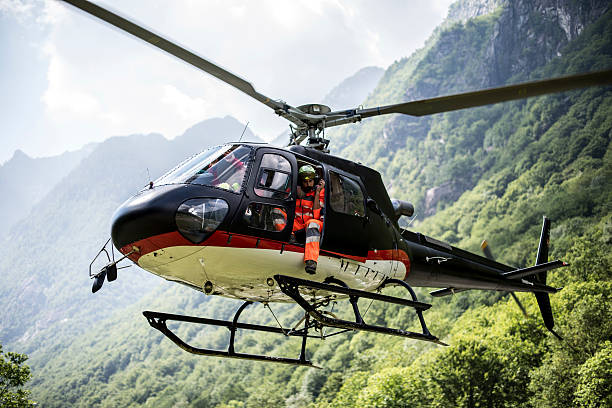 istock Helicopter hovers above grassy landing area 486364400