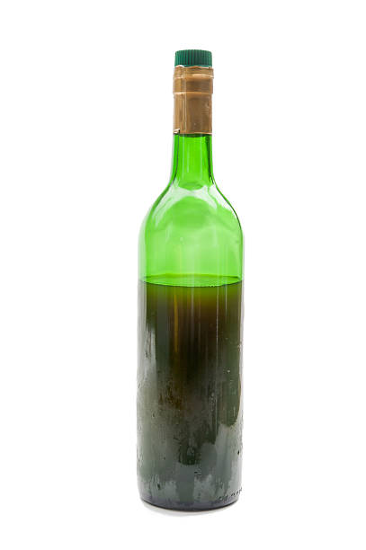 istock red Wine in glass bottle isolated on white background 486364604
