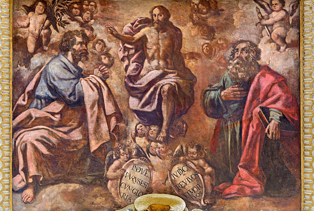 Fresco with religious saint and angels on the ceiling in a church.