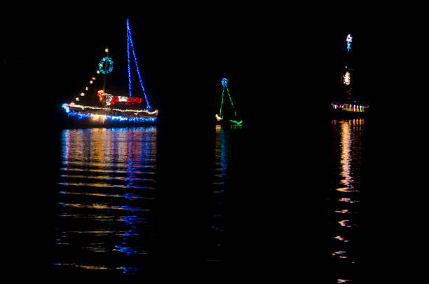 Christmas Sailboats in Nighttime Flotilla stock photo