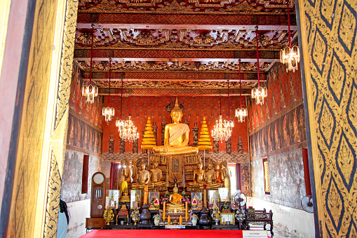 Buddha statue in Wat Si Chum temple located in the North zone of the Sukhothai Historical Park outside the walled city