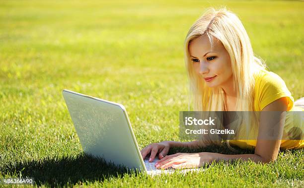 Blonde Girl With Laptop Smiling Beautiful Woman Stock Photo - Download Image Now - 2015, Adult, Animal