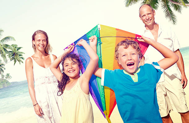istock Family Beach Enjoyment Holiday Summer Concept 486367344