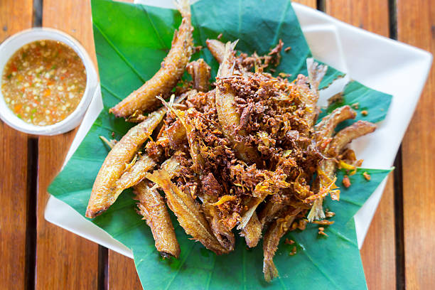 istock Fried Fish with Turmeric and Garlic served with spicy  dipping 486367664