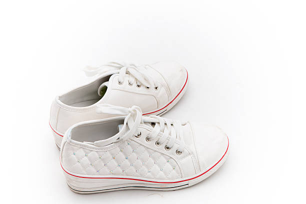 istock Pair of new  sneakers on white background 486368632