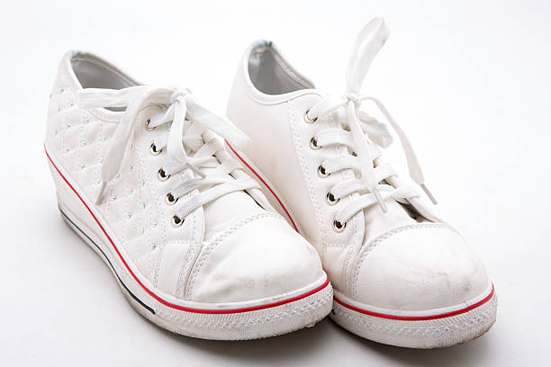 istock Pair of new  sneakers on white background 486368644