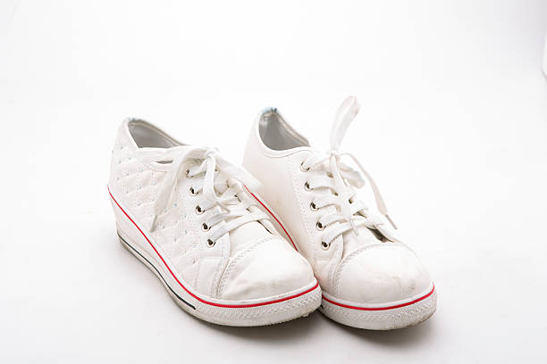 istock Pair of new  sneakers on white background 486368646