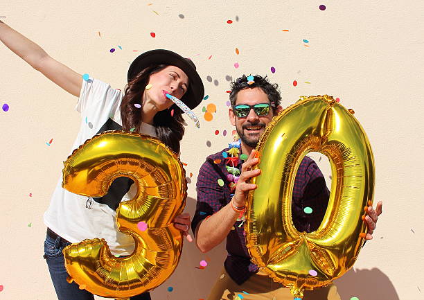 istock Cheerful couple celebrates a thirty years birthday 486371318