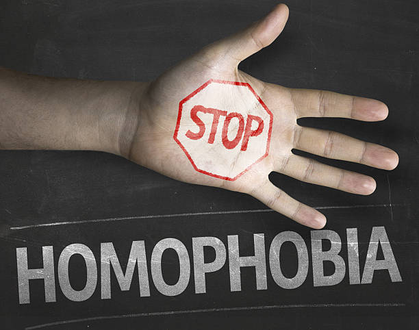 Educational and Creative composition with the message Stop Homophobia Educational and Creative composition with the message Stop Homophobia on the blackboard ending racism stock pictures, royalty-free photos & images