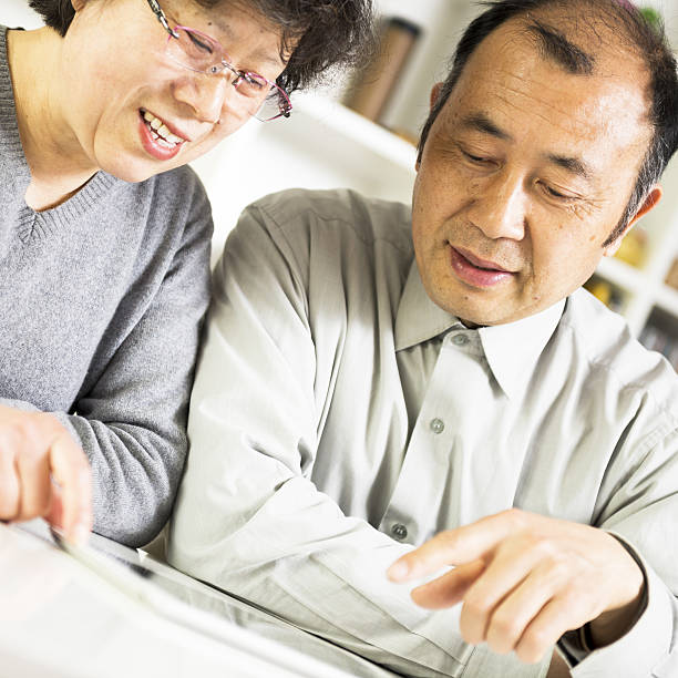 istock Asian senior couple using a tablet together 486374175