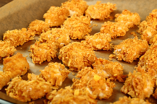 Making oven baked corn flake crumbs chicken nuggets. Series.