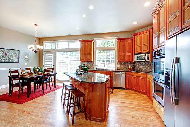 istock Modern kitchen room with island and dining area 486375863