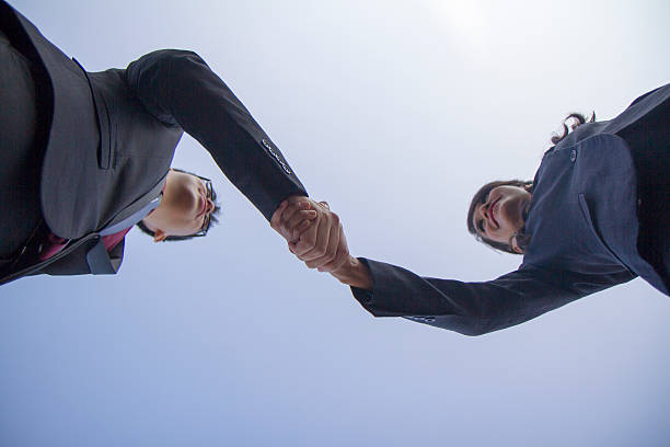 istock Asian Business Hand Shake, taken in abstract style 486376139