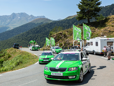 Col D'Aspin,France- July 15,2015: Skoda Caravan during the passing of the Publicity Caravan on a Col d'Aspin in Pyerenees Mountains in the stage 11 of Le Tour de France 2015. Skoda is the official car of the competition and sponsors the Green Jersey.
