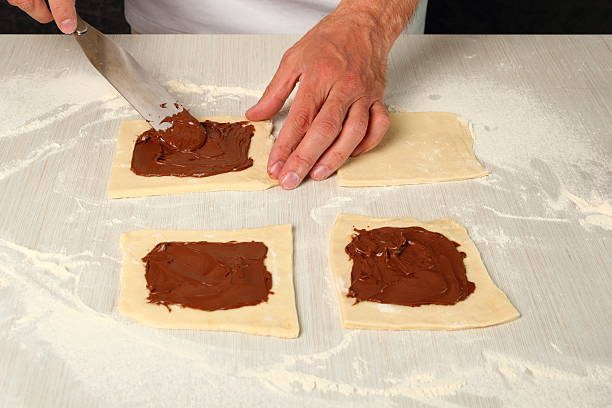 istock Making Chocolate Croissants with Puff Pastry 486376605