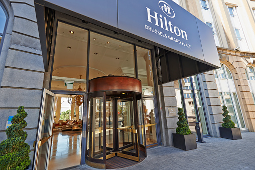 Brussels,Belgium - August 29, 2015: The main entrance and the Glass revolving door at Hotel Hilton Grand Place in Brussels on 29 August 2015