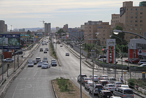 Ulaanbaatar, Mongolia - July 8, 2015: people in cars are waiting green light on the intersection in Ulaanbaatar, Mongolia