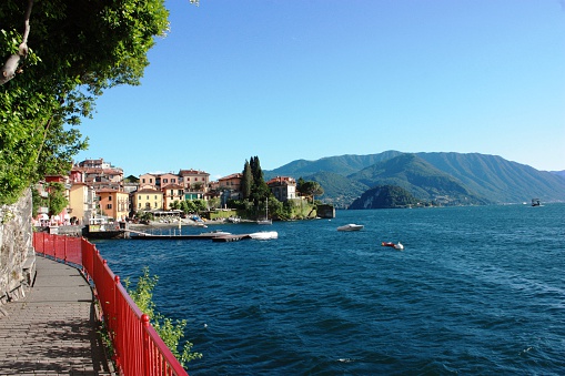 Varenna lakefront on the shores of Lake Como under blue sky in Lombardy Italy