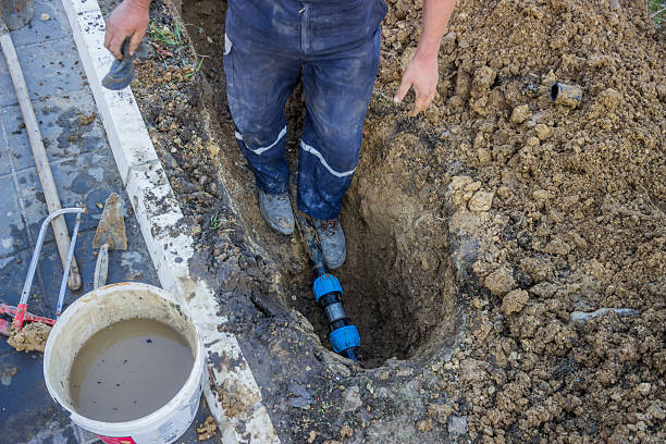 istock utility worker in trench repair the broken pipe 3 486378827