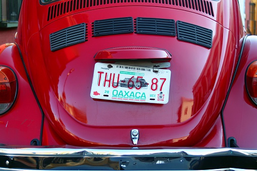 Oaxaca, Mexico - March 9, 2007: Close-up of tailgate and license plate of an old Volkswagen beetle parked in the Mexican city's streets.