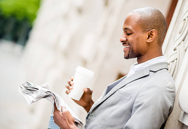 istock Business man reading newspaper 486381411