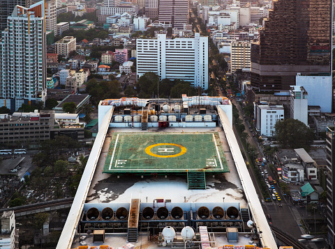 Helicopter landing pad on roof top building in Bangkok, Thailand.