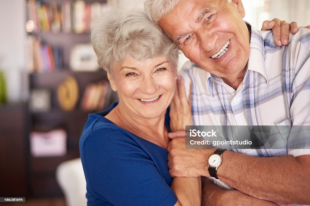 Portrait of happy senior couple in arms Senior Couple Stock Photo