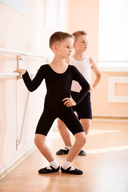 Young boys working at the barre stock photo