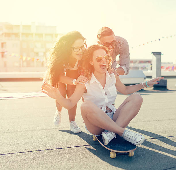 istock Teenagers skateboarding on the rooftop 486383402