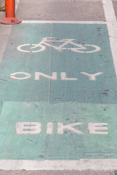 istock bicycle lane sign on road. 486385890