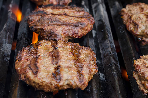 istock Burgers on the grill 486387096