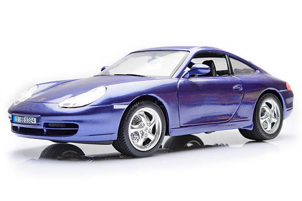 Kampen, The Netherlands - March 25, 2014: Porsche 911 (996) sports car model by Bburago isolated on a white background.