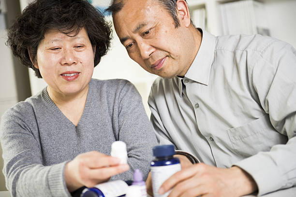 istock Asian couple and medicines 486390245