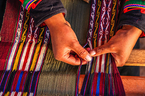 istock Peruvian woman weaving, The Sacred Valley, Chinchero 486390321