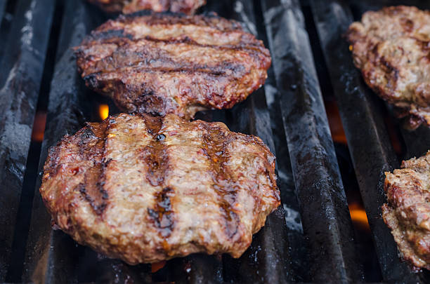 istock Burgers on the grill 486390742