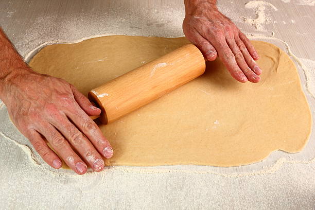 istock Making Poppy Seed Snail. Sweet Roll Bun. 486390883
