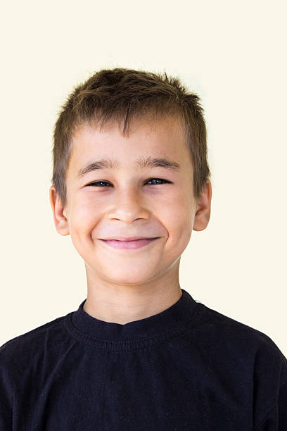 istock Smiling cute little boy against colored background 486391244