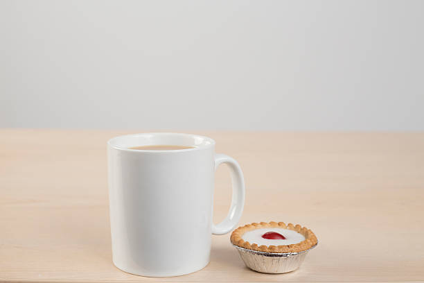 Tea and bakewell tart Tea and cake bakewell photos stock pictures, royalty-free photos & images