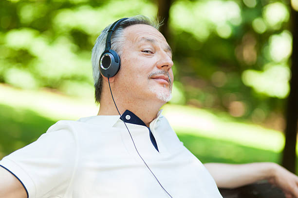 istock Retired man listening to some music 486391380