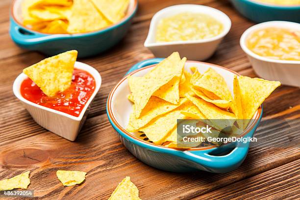 Plate Of Nachos With Different Dips Stock Photo - Download Image Now - 2015, Appetizer, Avocado