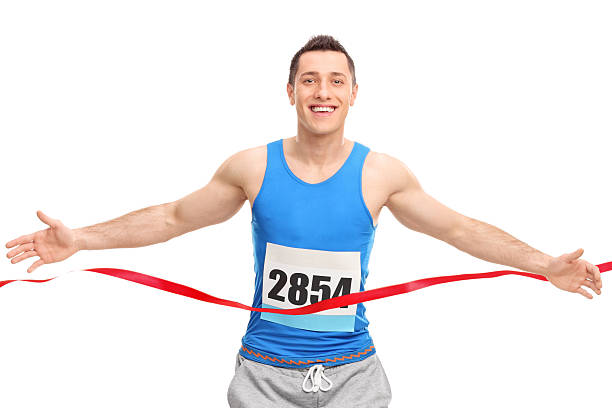 istock Male runner crossing the finish line 486392190
