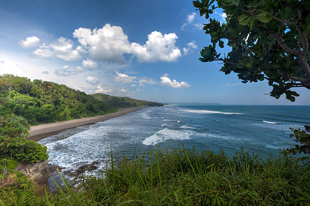 istock Beach coast with blue sky and green hill 486393945