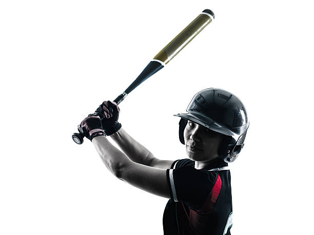 istock woman playing softball players silhouette isolated 486395428