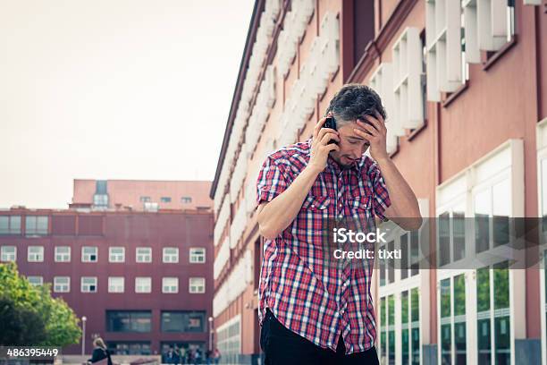 Man In Short Sleeve Shirt Talking On Phone Stock Photo - Download Image Now - Adult, Crying, Despair