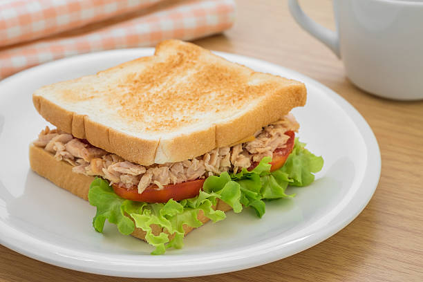 istock Tuna sandwich on plate and coffee cup 486395726